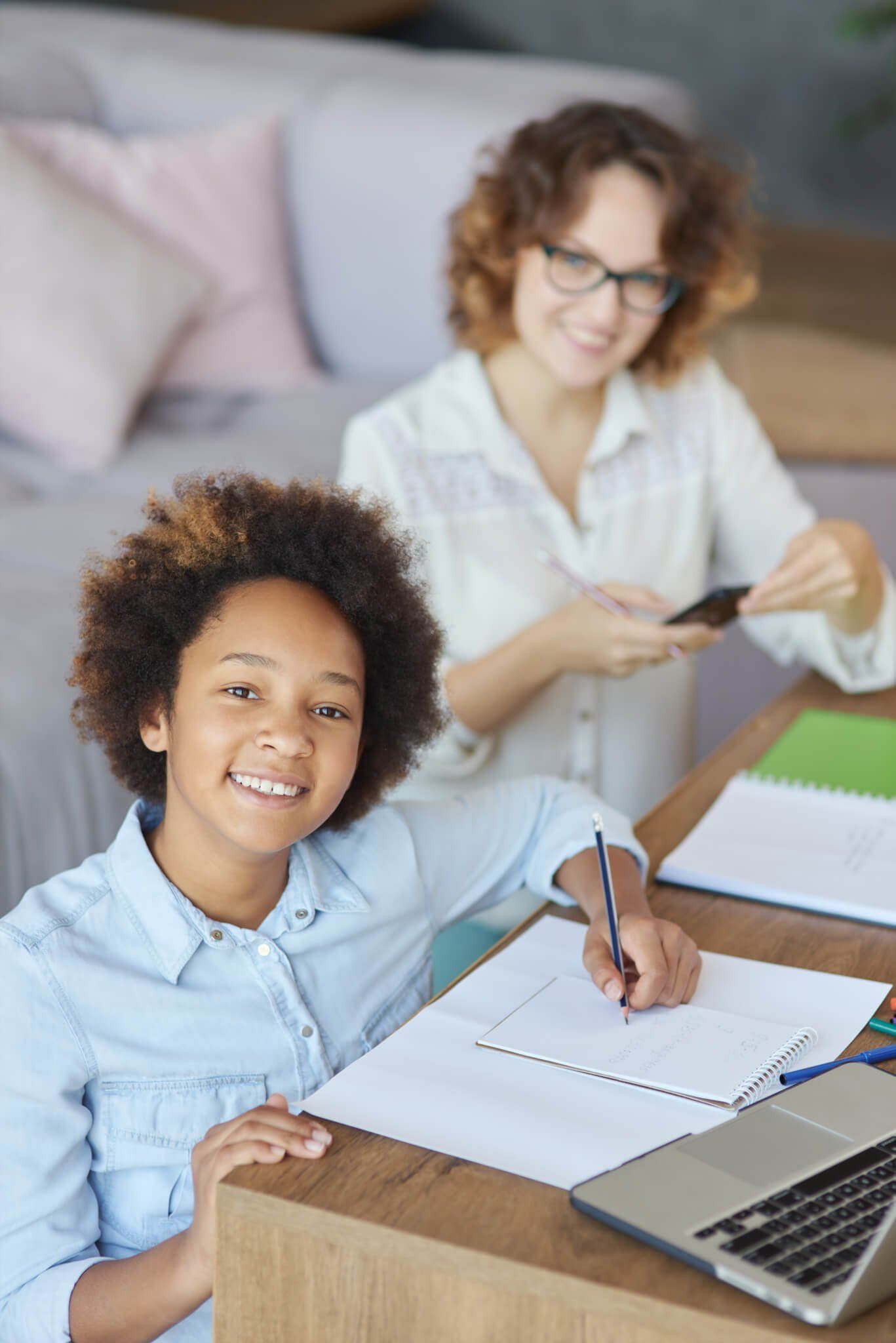 radiate-happiness-happy-mixed-race-teen-schoolgirl-smiling-at-camera-while-having-a-lesson-with.jpg